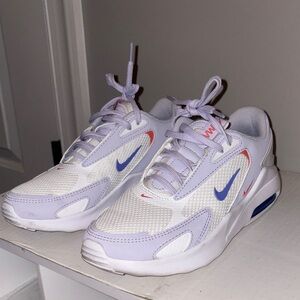 Nike air max bolts women’s in light purple, orange, and dark blue.